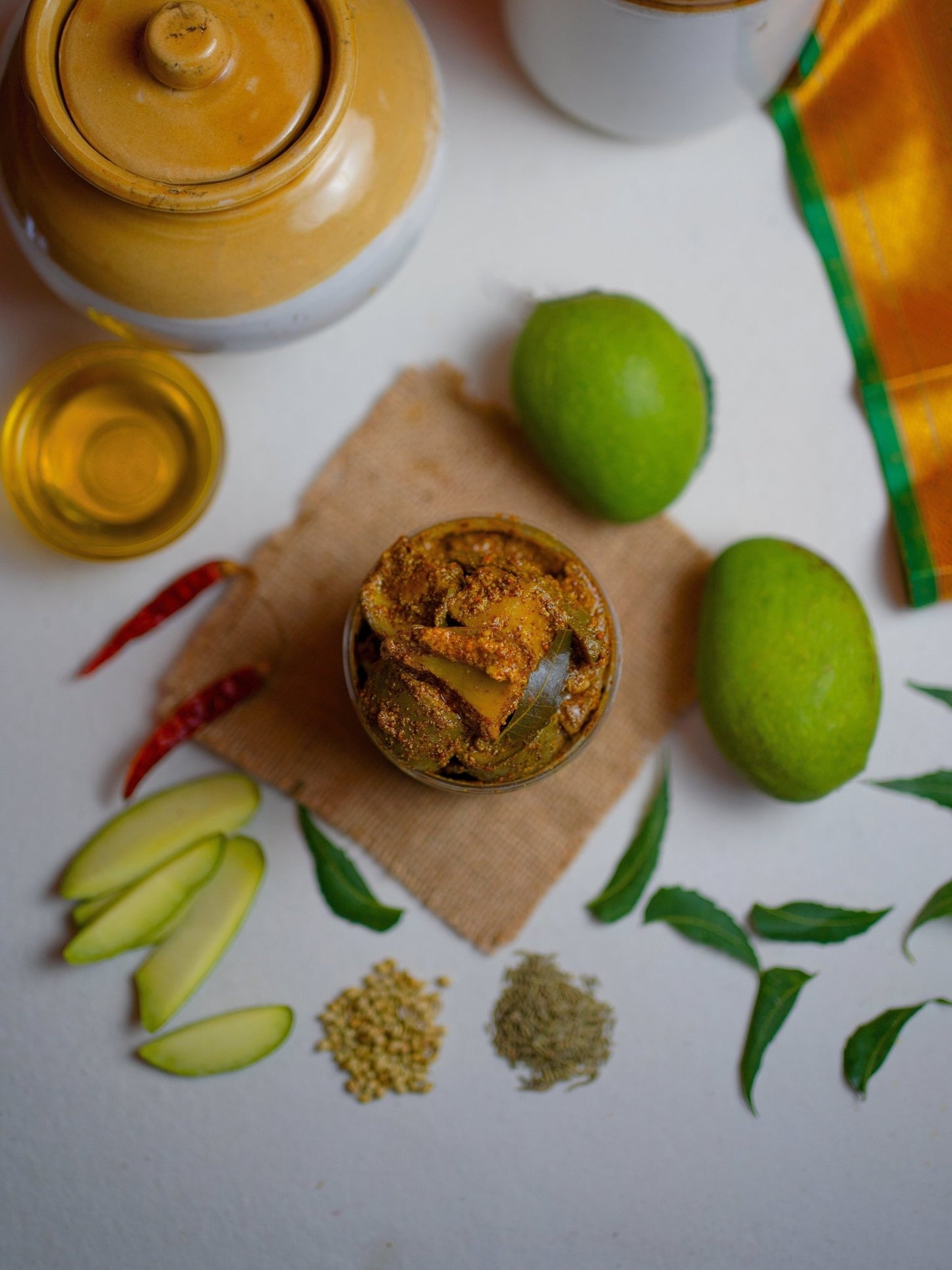 Top view of FarmDidi traditional Indian mango pickle. From Andhra Avakaya to Gujarati Chunda, mango pickles vary across India, showcasing diverse regional spices and flavors.