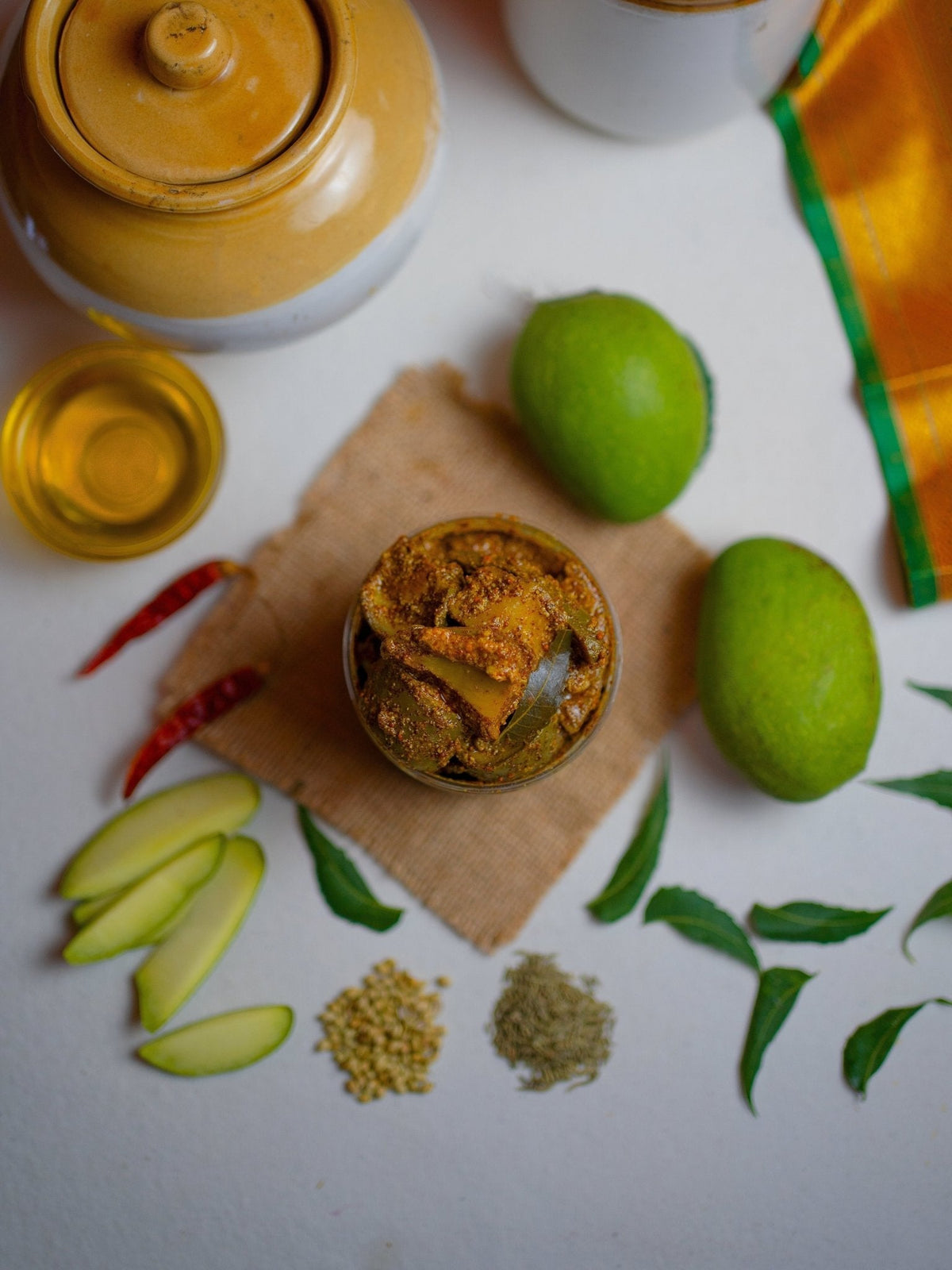 Top view of FarmDidi traditional Indian mango pickle. From Andhra Avakaya to Gujarati Chunda, mango pickles vary across India, showcasing diverse regional spices and flavors.