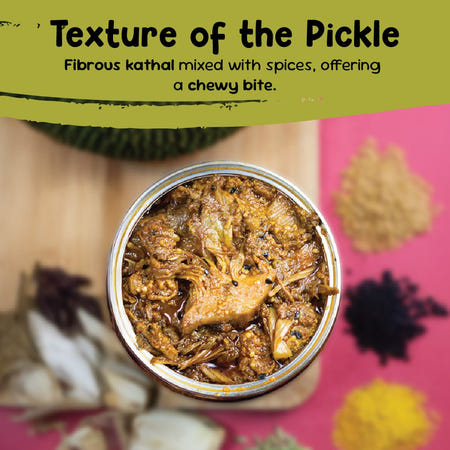 Close-up of jackfruit pickle with fibrous kathal pieces coated in whole spices