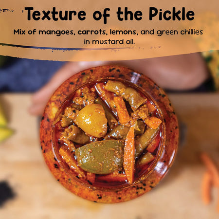 Close-up texture of mixed vegetable pickle with mango, carrot, lemon and green chilli in mustard oil