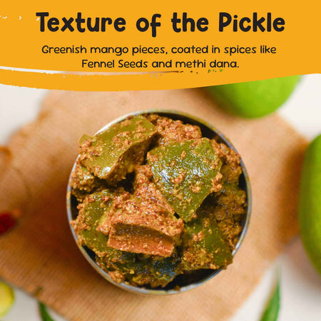 Close-up of FarmDidi raw mango pickle texture with mango pieces coated in fennel seeds and fenugreek