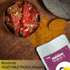 Texture of FarmDidi Banarasi Vegetable Pickle Masala with red chilli pickle in a bowl 