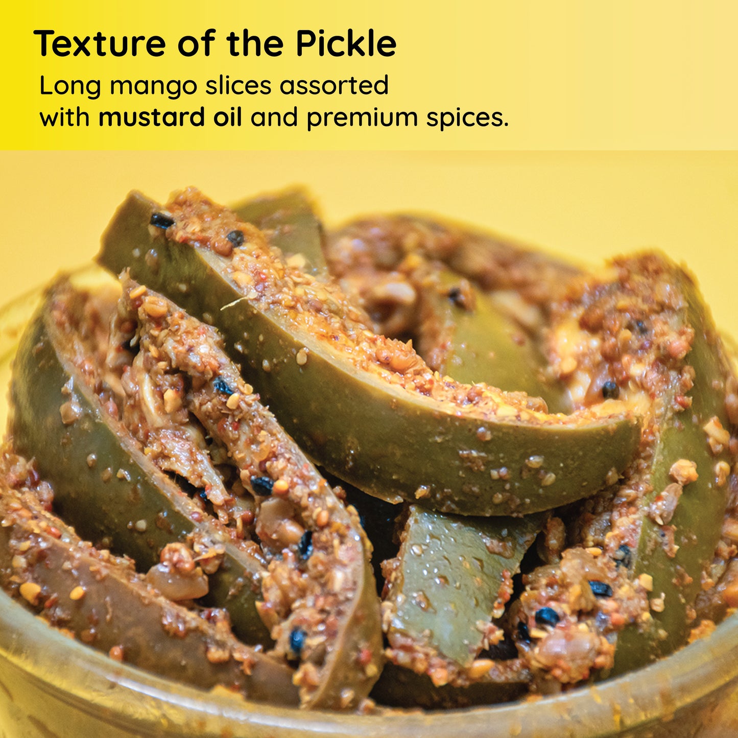 Texture of the dry mango pickle by FarmDidi. It has slices of mangoes marinated with spices such as kalonji, methi dana, black mustard seeds, etc.